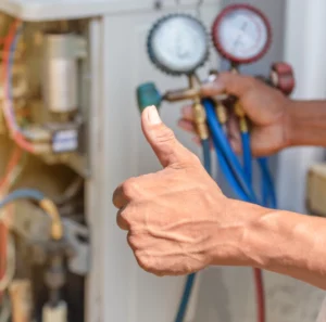 close up of technician repairing the heating system unit