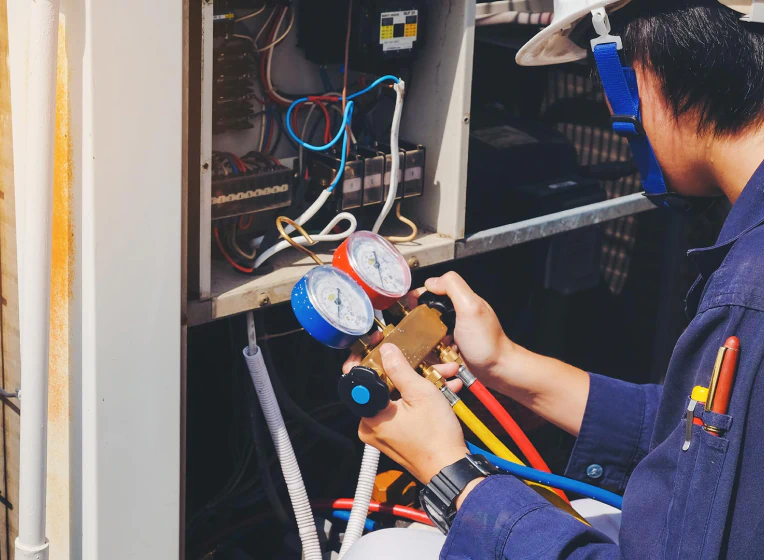 technician repairing hvac unit